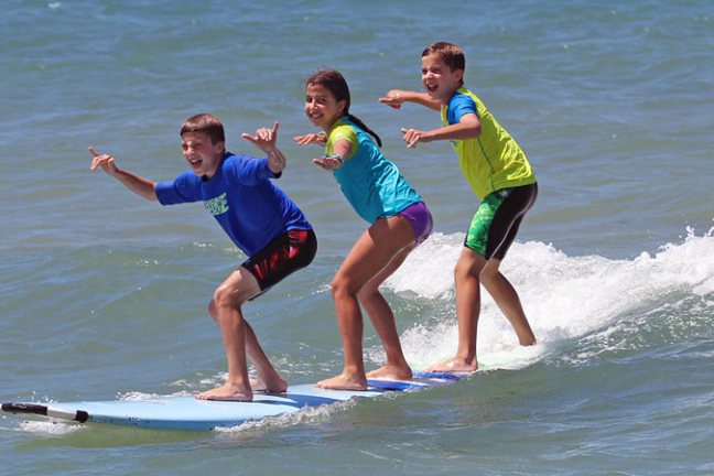 a person riding a wave on a surfboard in the water